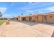 Spacious covered patio overlooking backyard hardscape featuring concrete, block fence, ceiling fans, and space for outdoor furniture at 636 S Rosemont --, Mesa, AZ 85206