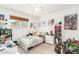 Fun bedroom with a twin bed, plenty of toys, and a window, creating an imaginative space at 6749 E Lewis Ave, Scottsdale, AZ 85257