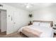 Cozy bedroom with a ceiling fan and comfortable queen-sized bed, offering a relaxing retreat at 6749 E Lewis Ave, Scottsdale, AZ 85257