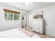 Bright bedroom with a large window, dresser, and stylish decor, creating a serene atmosphere at 6749 E Lewis Ave, Scottsdale, AZ 85257