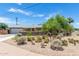 Charming home featuring a desert landscaped front yard and well-maintained facade at 6749 E Lewis Ave, Scottsdale, AZ 85257