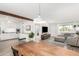 Open-concept living area with a kitchen, dining table, and comfortable living room, perfect for gatherings at 6749 E Lewis Ave, Scottsdale, AZ 85257