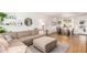 Spacious living room with a cozy sectional sofa, ottoman, and dining area, perfect for gatherings at 6749 E Lewis Ave, Scottsdale, AZ 85257