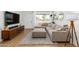 Inviting living room features a comfortable sectional sofa and ample natural light from the large window at 6749 E Lewis Ave, Scottsdale, AZ 85257