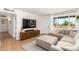Bright and airy living room with stylish furniture, a large window, and a seamless flow for entertaining at 6749 E Lewis Ave, Scottsdale, AZ 85257