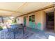 Covered patio featuring outdoor dining, sitting area, and neutral colors at 6749 E Lewis Ave, Scottsdale, AZ 85257