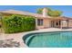 Stunning backyard with a private pool, lush greenery, and mature trees at 7345 E Forge Ave, Mesa, AZ 85208
