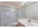 Well-lit bathroom featuring a glass-enclosed shower and a vanity with a sink at 7345 E Forge Ave, Mesa, AZ 85208