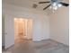 Spacious bedroom featuring an open doorway and ceiling fan at 7345 E Forge Ave, Mesa, AZ 85208