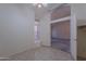 Bright bedroom features neutral walls, a window seat, and open doorway at 7345 E Forge Ave, Mesa, AZ 85208