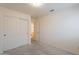 Bedroom features a closet with sliding doors, neutral walls and natural light at 7345 E Forge Ave, Mesa, AZ 85208