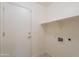 Laundry room with tile floor, utility sink hookup, and plenty of space for storage at 7345 E Forge Ave, Mesa, AZ 85208