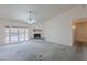 Living room area with fireplace, patio access, and neutral decor creating a welcoming space at 7345 E Forge Ave, Mesa, AZ 85208