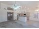 Spacious living area with kitchen access, neutral walls, and a well-lit atmosphere at 7345 E Forge Ave, Mesa, AZ 85208