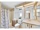 Bathroom with a vanity, toilet, shower, and decorative accents providing a functional and tidy space at 7711 E Farmdale Ave, Mesa, AZ 85208