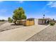Charming single-story home with covered parking, complemented by mature trees and a low-maintenance landscape at 7711 E Farmdale Ave, Mesa, AZ 85208