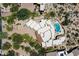 Expansive aerial view of an estate with lush landscaping, pool, and desert surroundings at 7731 E Soaring Eagle Way, Scottsdale, AZ 85266
