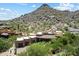 Aerial view of Southwestern-style home with desert landscaping and mountain views at 7731 E Soaring Eagle Way, Scottsdale, AZ 85266