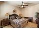 Bedroom with a ceiling fan, and stylish furniture and decor at 7731 E Soaring Eagle Way, Scottsdale, AZ 85266