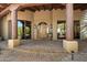 Inviting home entrance with a beautiful stone walkway and a covered porch at 7731 E Soaring Eagle Way, Scottsdale, AZ 85266