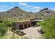 Southwestern-style home with a three-car garage and desert landscaping at 7731 E Soaring Eagle Way, Scottsdale, AZ 85266