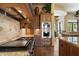 A kitchen features a gas stovetop, granite countertops, stainless steel appliances, and tile backsplash at 7731 E Soaring Eagle Way, Scottsdale, AZ 85266