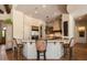 A kitchen features granite countertops, an island with barstool seating, and stainless steel appliances at 7731 E Soaring Eagle Way, Scottsdale, AZ 85266
