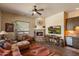Inviting living room features a cozy fireplace, Southwestern decor, and comfortable seating at 7731 E Soaring Eagle Way, Scottsdale, AZ 85266