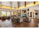 Spacious living room featuring stone fireplace, beamed ceilings, and tile floors at 7731 E Soaring Eagle Way, Scottsdale, AZ 85266