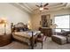 The main bedroom features a bed, nightstands, a dresser, a bench, and a chaise lounge at 7731 E Soaring Eagle Way, Scottsdale, AZ 85266