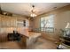 Home office with a large desk, built-in shelves, and a ceiling fan at 7731 E Soaring Eagle Way, Scottsdale, AZ 85266
