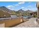 Inviting pool area with a built-in outdoor grill and mountain views at 7731 E Soaring Eagle Way, Scottsdale, AZ 85266