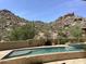 A tranquil pool area is surrounded by desert landscape with a spa, perfect for relaxation and enjoying the Arizona sunshine at 7731 E Soaring Eagle Way, Scottsdale, AZ 85266