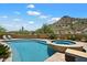 Inviting pool and spa with desert views and lounge chairs for relaxing and enjoying the outdoor space at 7731 E Soaring Eagle Way, Scottsdale, AZ 85266