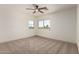 Bright bedroom with carpet and natural light, ideal for relaxation and rest at 82 N 221St Ave, Buckeye, AZ 85326