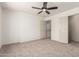 Bedroom with ceiling fan and neutral color palette at 82 N 221St Ave, Buckeye, AZ 85326