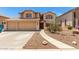 Inviting two-story home with a large two car garage and a beautifully landscaped front yard at 82 N 221St Ave, Buckeye, AZ 85326