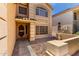 Welcoming front entrance with tiled porch and well-maintained landscaping at 82 N 221St Ave, Buckeye, AZ 85326