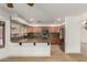 Well-lit kitchen featuring wooden cabinetry, stainless steel appliances, and granite countertops at 82 N 221St Ave, Buckeye, AZ 85326