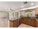 Spacious kitchen with granite countertops, stainless steel dishwasher, and natural light, offering a modern and functional design at 82 N 221St Ave, Buckeye, AZ 85326