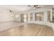 Bright open-concept living room with sliding door access to the backyard at 82 N 221St Ave, Buckeye, AZ 85326