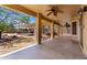 Covered patio with ceiling fans, and view of the pergola and outdoor seating area at 82 N 221St Ave, Buckeye, AZ 85326