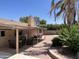 Spacious backyard with covered patio, gravel landscaping, and desert plants offering an outdoor living space at 8355 E Via De Encanto --, Scottsdale, AZ 85258