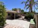 Backyard patio with pavers, covered seating area, and landscaping at 8355 E Via De Encanto --, Scottsdale, AZ 85258