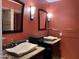 Bathroom featuring dual sinks with vessel basins, granite countertops, and unique wall sconces and mirrors at 8355 E Via De Encanto --, Scottsdale, AZ 85258