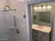 Bathroom featuring a walk-in shower and vanity with custom mirror and light fixtures at 8355 E Via De Encanto --, Scottsdale, AZ 85258