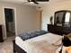 Bedroom featuring a dark brown color scheme and a king-sized bed with an ensuite bathroom at 8355 E Via De Encanto --, Scottsdale, AZ 85258