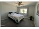 Carpeted bedroom with a ceiling fan, window, and neutral colored walls at 8355 E Via De Encanto --, Scottsdale, AZ 85258