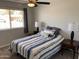 Bedroom showcasing lots of natural light, soft decor, and a comfortable queen bed with a blue and white comforter at 8355 E Via De Encanto --, Scottsdale, AZ 85258