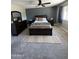 Comfortable bedroom with dark wood furnishings, ceiling fan, and neutral color palette at 8355 E Via De Encanto --, Scottsdale, AZ 85258
